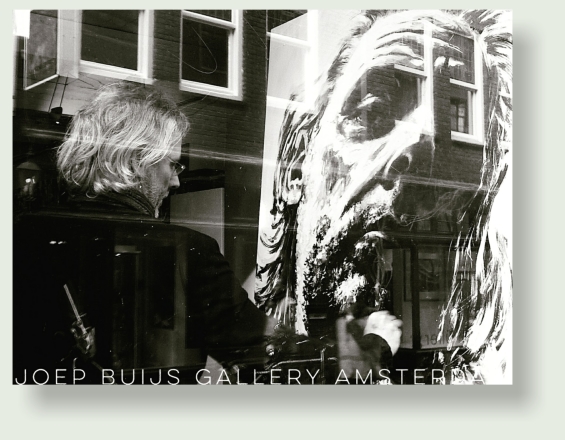 Joep Buijs painting TELL ME  behind glass window of his Amsterdam gallery